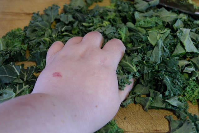 My hand massaging the kale before I put it in the salad bowl.