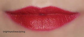 Swatch of M.A.C Russian Red Lipstick Swatch of M.A.C Russian Red Lipstick- natural light, heavier application