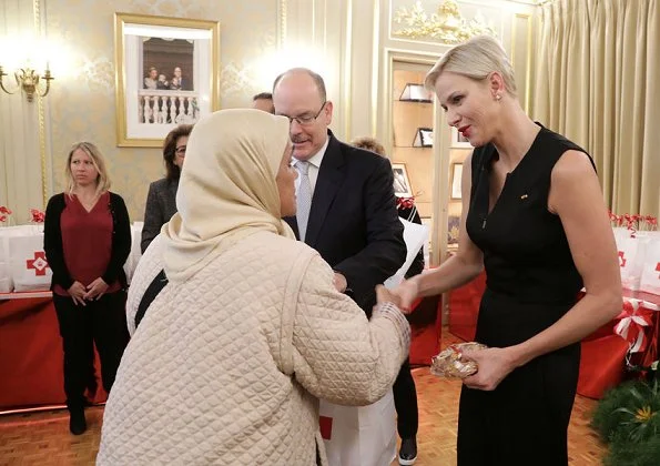 Monaco National Day 2017 christmas gifts ceremony. Princess Charlene wore Akris Stretch Silk Jumpsuit