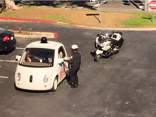 Google car and police in traffic