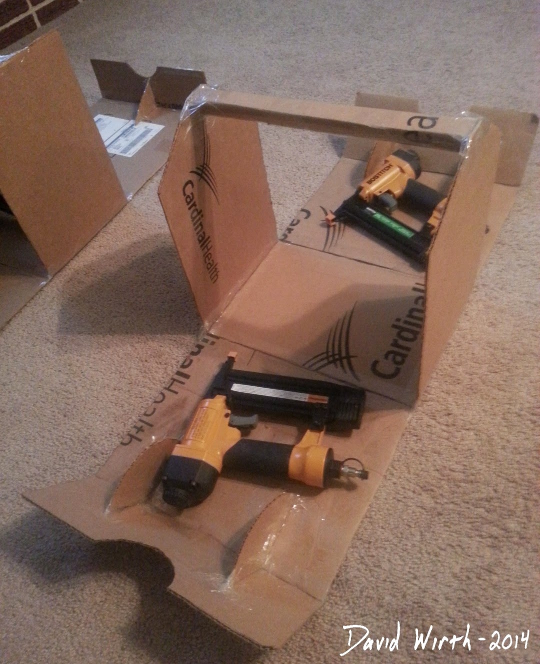 test fit tool box, cardboard, wood, nail gun