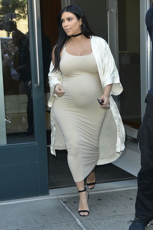 Kim Kardashian flaunts her bump whilst pregnant with son, Saint. 