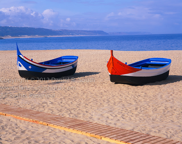 a fine art photograph of fishing boats based on an ancient phoenician design in portugal