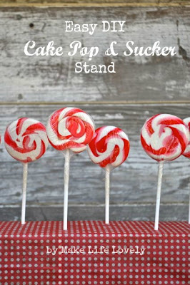 red and white lollipops in red and white lollipop stand