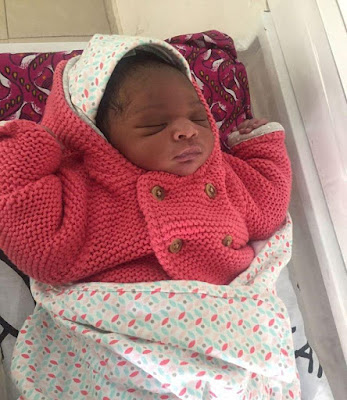 b Photos: Emir of Kano cradles his new grandchild