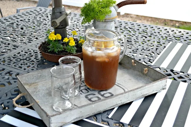 Iced tea pitcher in industrial tray