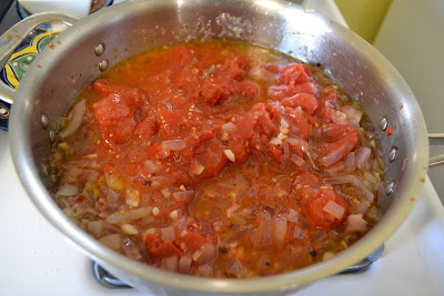 After deglazing with vodka, add whole San marzano tomatoes and palce in oven to cook for an hour.