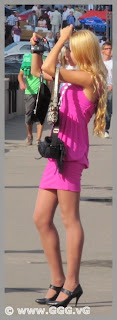 Sexy blonde girl in pink mini-dress