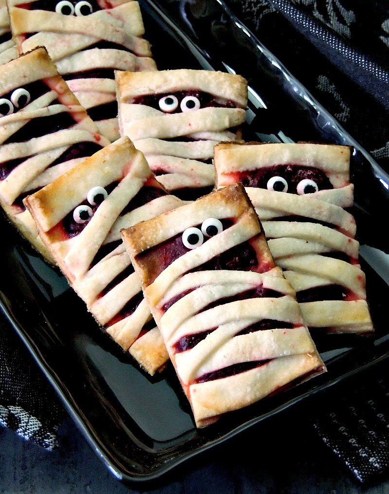 These little Cheesecake Mummies Cookies try to be scary, but they are just too cute #cookies #Halloween #Mummies #mummy #cheesecake #recipe | bobbiskozykitchen.com