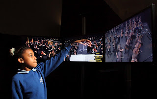 Child using one of the conductor pods, Universe of Sound, Philharmonia Orchestra, Science Museum