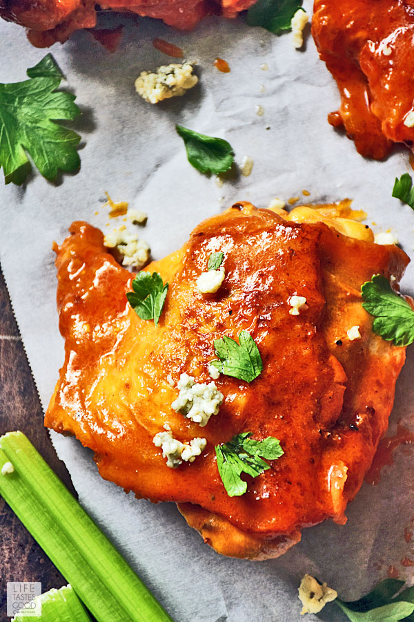 Dripping in a spicy, buttery buffalo wing sauce, Baked Buffalo Chicken Thighs are just as good, if not better, than your favorite buffalo chicken wings. They are low carb, easy to make, and budget-friendly too! #LTGrecipes