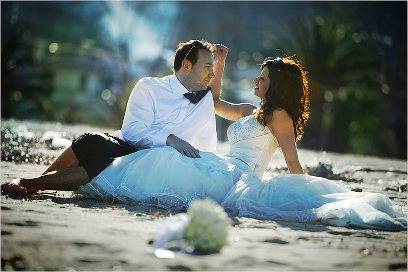 ZorbaWeddings.com_bride_groom_sitting_flowers_affection_love_sand_beach_golden_Greece_Greek_Destination_Wedding_Photographer_174.jpg