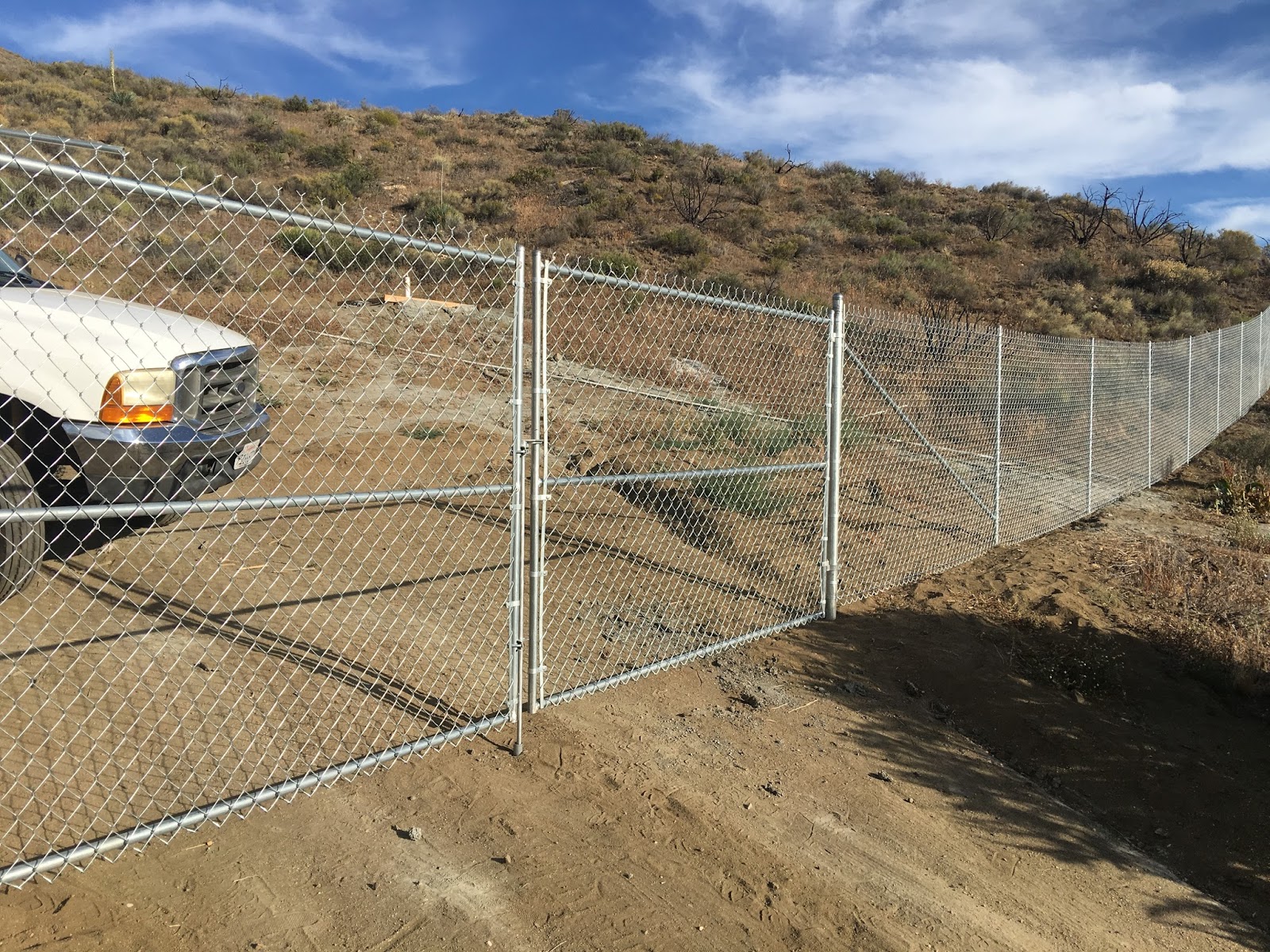 The Fence CHAIN LINK ON HILLSIDE