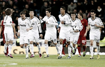 Real Madrid players run after score a goal looking for a comeback