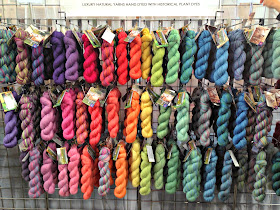 the natural dye studio - a wall of colourful wool silk yarn