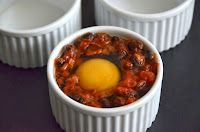 MEXICAN BAKED EGGS WITH BLACK BEANS, TOMATOES, CHILLI AND CORIANDER MEXICAN BAKED EGGS WITH BLACK BEANS, TOMATOES, CHILLI AND CORIANDER