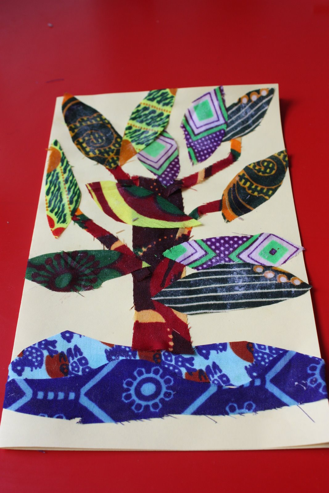 whirls and twirls around the world Kenya crafts tree fabric collage