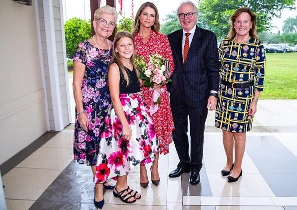 Princess Madeleine wore a new asymmetric paisley-print silk dress by Veronica Beard, and Ebba Brahe earrings. Leonore, Nicolas and Adrienne