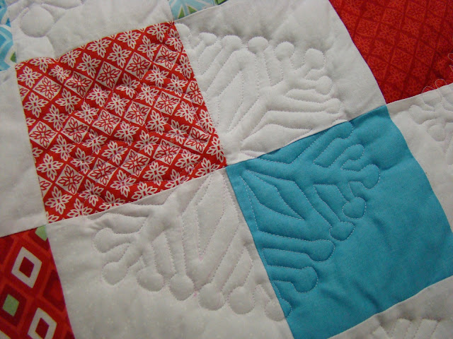 On point charm square Christmas quilt with Kate Spain Flurry fabric