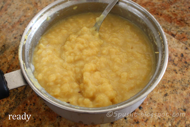 To cook dal in a pan: mash dal to test if dal is boiled, soft, and ready