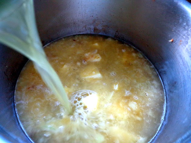 Pour in the stock and simmer