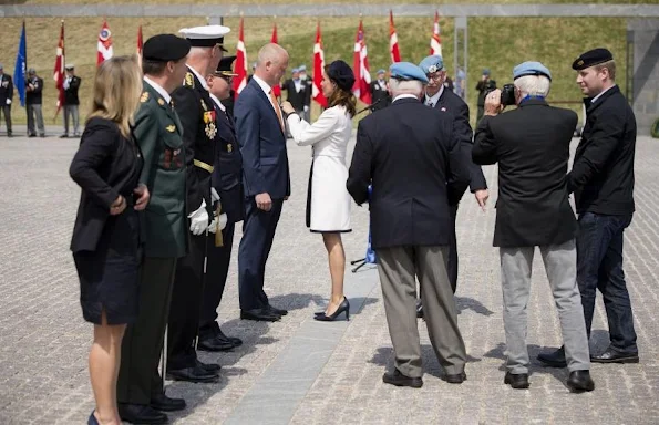 Princess Marie of Denmark participates In Internation Peacekeepers Day at The Citadel. Marie wears Paule Ka White Two-Tone Belted Coat, By Malene Birger Paxlow Pump