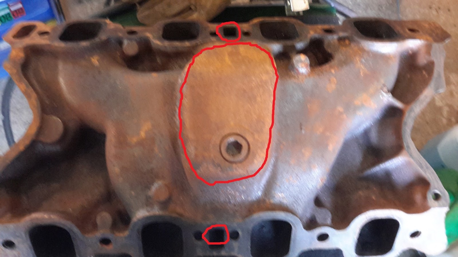 Kvicksilverpuman Heat riser delete, exhaust port block off.