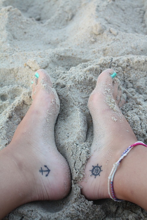 Simple anchor and wheel on ankles Female tattoofemale
