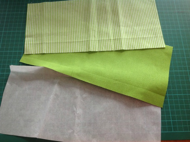 green plain and striped fabric and a piece of Bondaweb