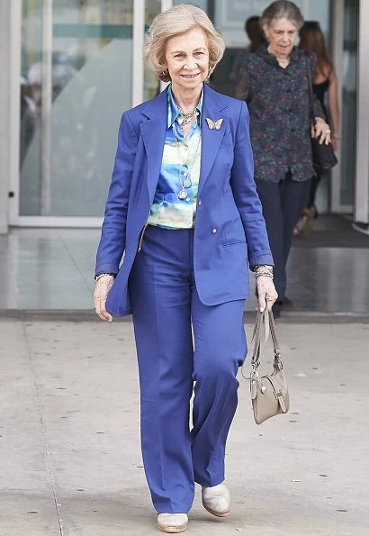 Queen Letizia wore Carolina Herrera navy ecru polka dot silk blouse. Queen Sofía and her sister, Princess Irene of Greece