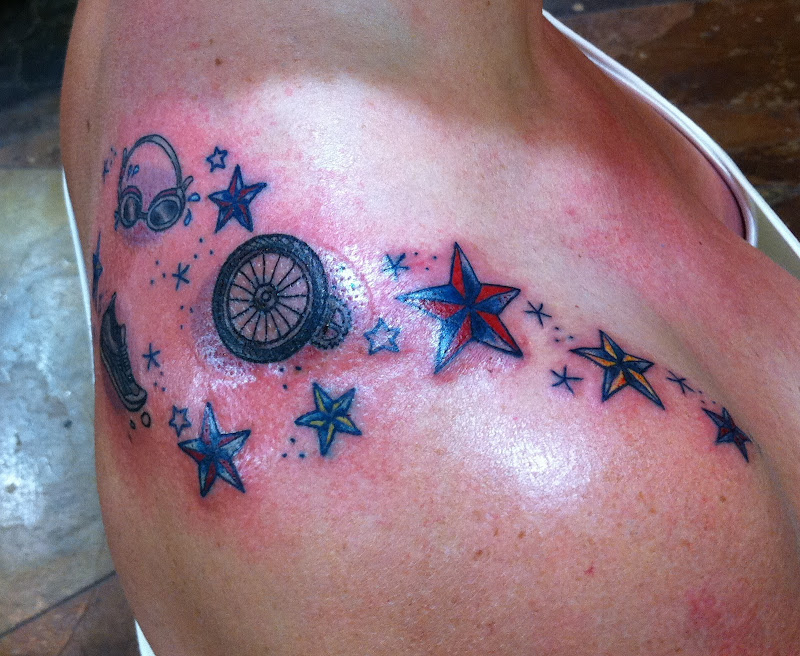 tattoo on Christina. A fun approach to the ironman/triathlon tattoo  title=
