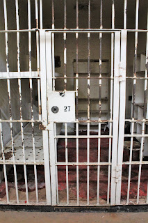 Picture of a prison cell with door closed