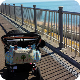 stroll on seafront, pink lining bag, double buggy at the seaside
