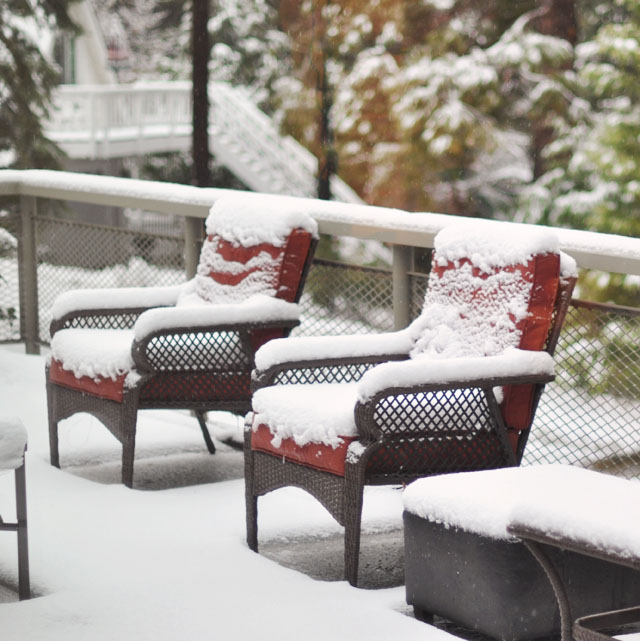 patio furniture covered in snow