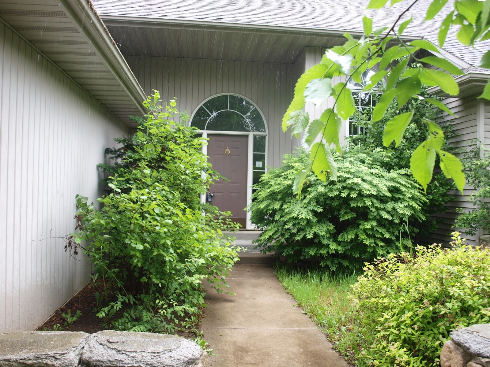 Before pic of courtyard in Hello Lovely Studio's fixer upper