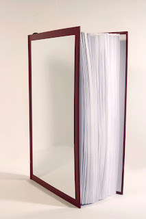 he mirror-book "Reflexions" can also be hanged on the wall