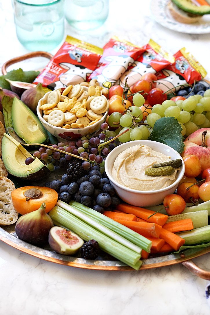 Beautiful kid-friendly party platter How to make a beautiful kid friendly party platter the whole family will love. Perfect for happy hour or birthday parties, this snack board is loaded with wholesome ingredients like fruit, veggies, nuts, hummus, and kids' snacks.