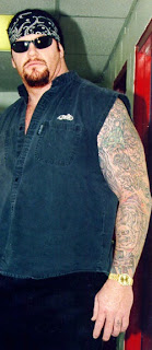 The Undertaker tattoos - WWE Superstar Undertaker Tattoo Designs