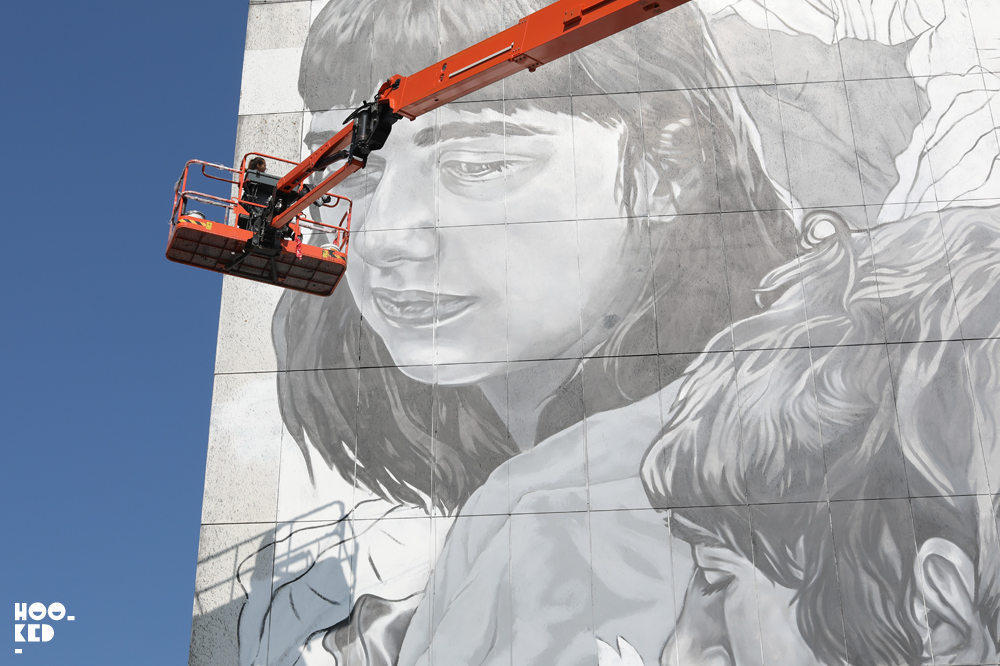 Paola Delfin high above Ostend at work on her large scale mural