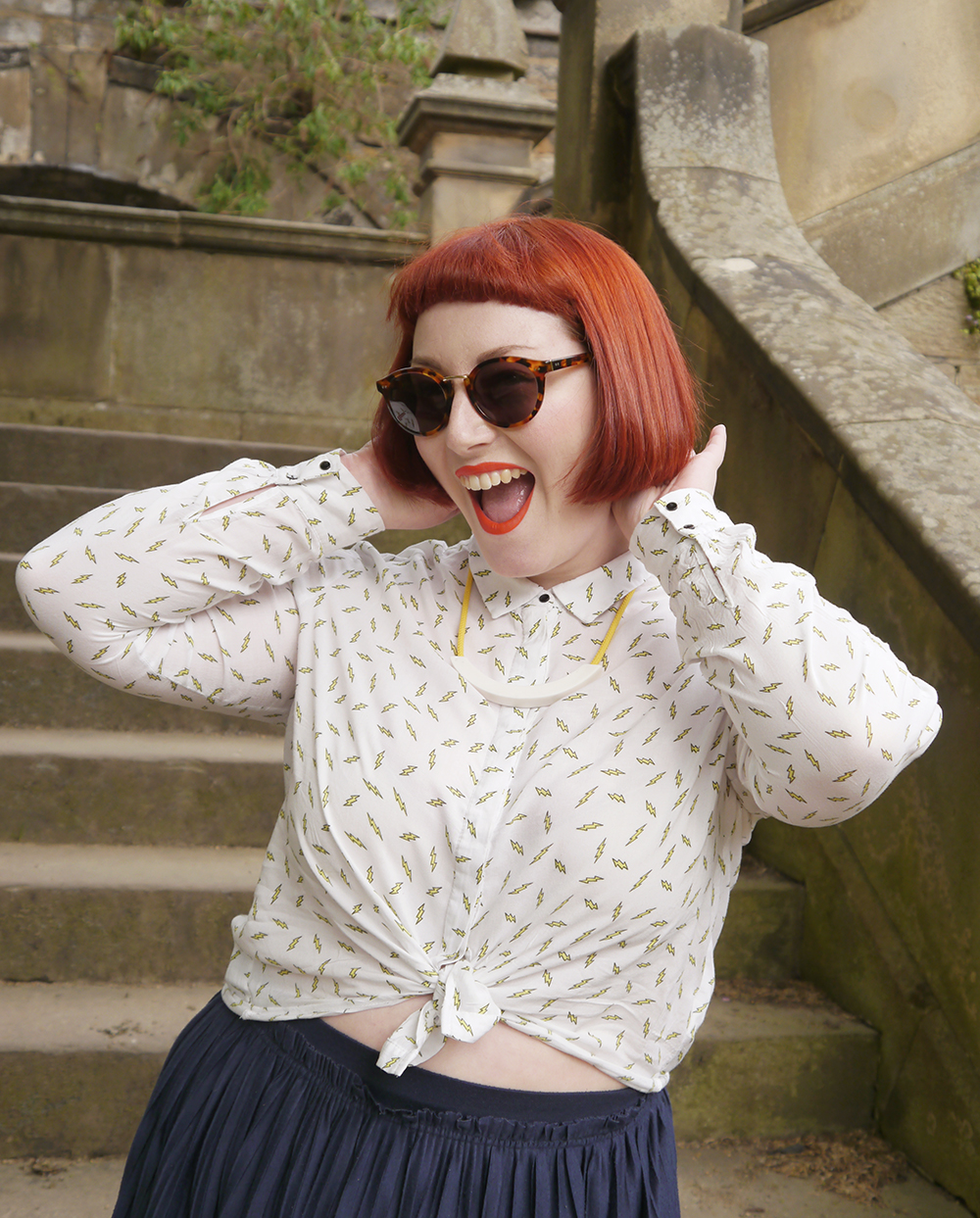 Scottish blogger, red head, Scottish street style, fun street style, colourful street style, colourful blogger, colourful outfit, red bob, ginger bob, sunlglasses style, #seewithiolla, iolla, Beth lamont necklace, yellow accessories, lightning bolt shirt, patterned shirt