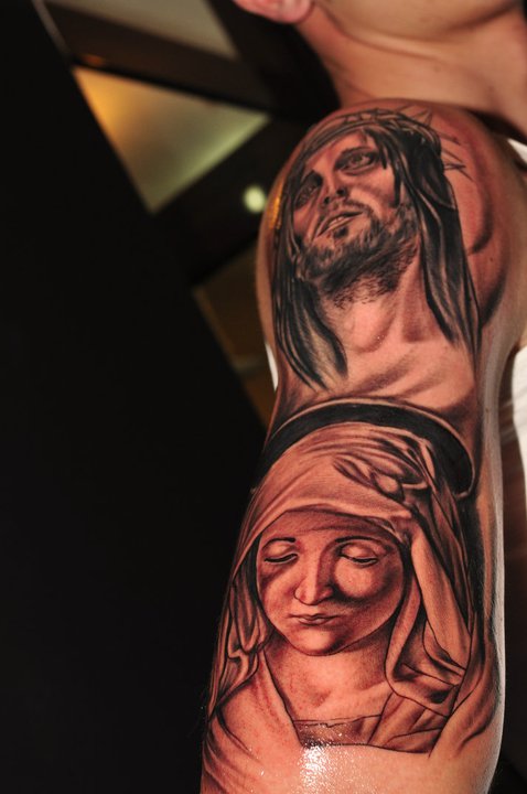 Religious sleeve tattoo