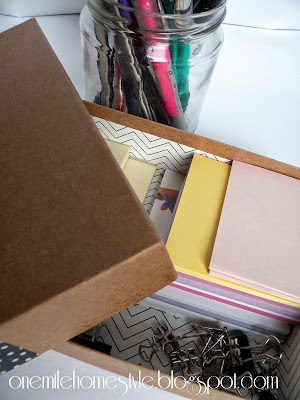 Notepads and post-its in a decorative box