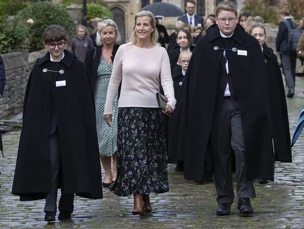 Countess of Wessex visited to join us in celebrating 25 years of Girl Choristers in Wells Cathedral Choir. floral print skirt and pink wool sweater