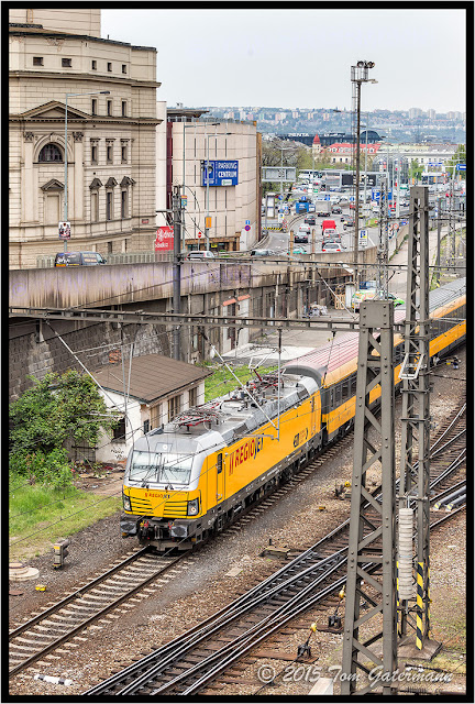 RegioJet 193 206-0 leads a passenger train away from Prague's Main Train Station