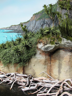 Diorama of bush by the sea.