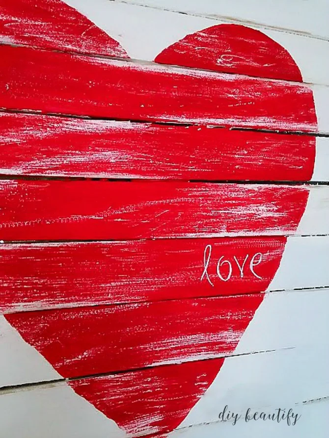 Make a mini pallet from wood shims, like this Valentines sign. Find the tutorial at diy beautify!