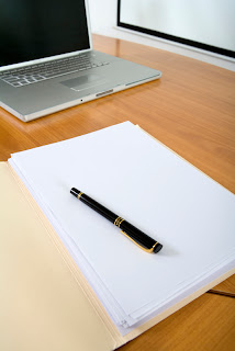 image of laptop and paper