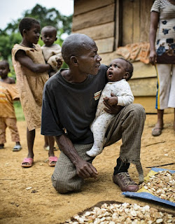 Father with his baby in the village of Ngon, Ebolowa District, Cameroon.