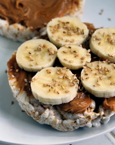 Peanut butter, honey, and banana rice cakes with toasted sesame seeds ...