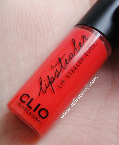 Clio Lipstealer gloss 12 - Catch Coral bottle